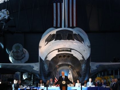 CHANTILLY, VA - OCTOBER 05: The Space Shuttle Discovery is the back drop as Vice President