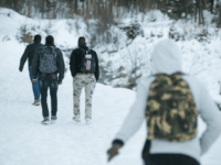 GettyImages-904466786 Migrants walk in the snow on their way to the Colle della Scala (Col de l'Echelle) a snow-covered pass to cross the border between Italy and France, on January 13, 2018 near Bardonecchia, Italian Alps. / AFP PHOTO / Piero CRUCIATTI (Photo credit should read PIERO CRUCIATTI/AFP/Getty Images)