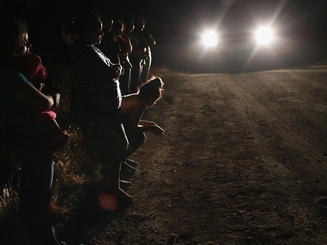 MCALLEN, TX - JUNE 12: Central American asylum seekers, including a Honduran girl, 2, and