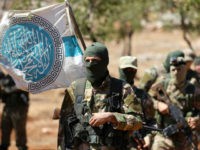 Hayat-Tahrir-al-Sham-Syria-fight-Getty Syrian fighters attend a mock battle in anticipation of an attack by the regime on Idlib province and the surrounding countryside, during a graduation of new Hayat Tahrir al-Sham (HTS) members at a camp in the countryside of the northern Idlib province on August 14, 2018. (Photo by OMAR HAJ …