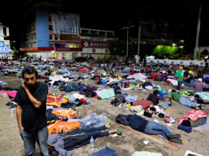 Honduran migrants hoping to reach the U.S. sleep in a public plaza in the southern Mexico