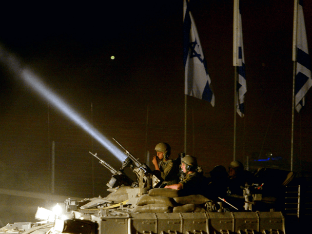 KISSUFIM CROSSING, GAZA STRIP - SEPTEMBER12: (ISRAEL OUT) An Israeli armored convoy leaves