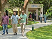 Infosys Employees Employees of Infosys Technologies Limited walk in the campus of the company's headquarters in Bangalore on April 13, 2017. Indian software giant Infosys has pledged to return USD2 billion to shareholders this year as it reported subdued growth in profits for the fourth quarter.