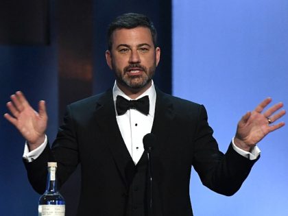 US TV host Jimmy Kimmel speaks next to a bottle of tequila during the 46th American Film Institute Life Achievement Award Gala at the Dolby Theatre in Hollywood on June 7, 2018. - The American Film Institute (AFI) is honoring US actor George Clooney with the 46th AFI Life Achievement …