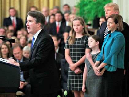 President Donald Trump listens to Justice Brett Kavanaugh during the ceremonial swearing-in ceremony of Kavanaugh as Associate Justice of the Supreme Court of the United States in the East Room of the White House in Washington, Monday, Oct. 8, 2018. Kavanaugh is accompanied by his wife Ashley Kavanaugh, third from …