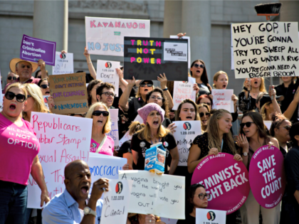People chant slogans outside Los Angeles City Hall during a protest against Supreme Court