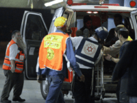 Magen David Adom ISRAEL OUT A wounded man is wheeled into a hospital in Jerusalem following a shooting attack on a religious school in the city in which at least eight students were killed on March 6, 2008. Some 35 people were wounded in the attack on the Merkaz Harav Yeshiva in the …