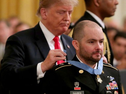 WASHINGTON, DC - OCTOBER 01: U.S. President Donald Trump awards the Medal of Honor to Ronald Shurer October 01, 2018 in Washington, DC. Shurer, a Special Forces combat medic, and his team of commandos were attacked by an enemy force of more than 200 fighters in April of 2008 in …
