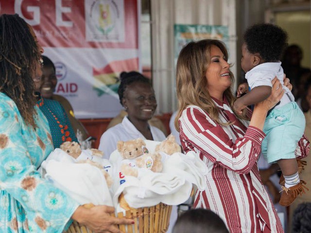 US First Lady Melania Trump holds a baby during a visit to the Greater Accra Regional Hospital in Accra, on October 2, 2018, as she begins her week long trip to Africa to promote her 'Be Best' campaign. (Photo by SAUL LOEB / AFP) (Photo credit should read SAUL LOEB/AFP/Getty …