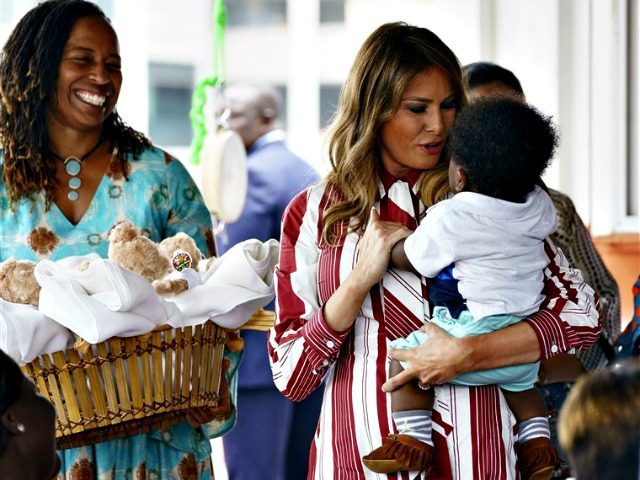 First lady Melania Trump holds a baby as she visits Greater Accra Regional Hospital in Accra, Ghana, Tuesday, Oct. 2, 2018. The first lady is visiting Africa on her first big solo international trip, aiming to make child well-being the focus of a five-day, four-country tour.