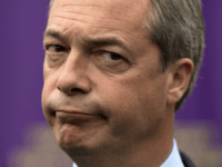 Nigel Farage, leader of the UK Independence Party (UKIP), is pictured as he unveils a campaign poster ahead of the Heywood and Middleton by-election in Heywood, Greater Manchester, on October 7, 2014. AFP PHOTO / OLI SCARFF (Photo credit should read OLI SCARFF/AFP/Getty Images)