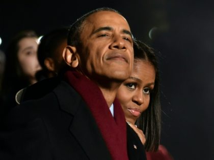 US President Barack Obama and First Lady Michelle Obama attend the National Christmas Tree