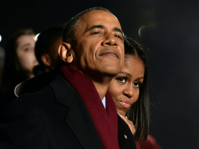 US President Barack Obama and First Lady Michelle Obama attend the National Christmas Tree Lighting on the Ellipse of the National Mall in Washington on December 1, 2016. / AFP / Nicholas Kamm (Photo credit should read NICHOLAS KAMM/AFP/Getty Images)