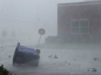 A trash can and debris are blown down a street by Hurricane Michael on October 10, 2018 in Panama City, Florida. The hurricane made landfall on the Florida Panhandle as a category 4 storm. (Photo by Joe Raedle/Getty Images)