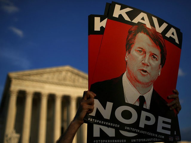 WASHINGTON, DC - OCTOBER 03: Protesters demonstrate against Supreme Court nominee Brett Kavanaugh outside the U.S. Supreme Court October 03, 2018 in Washington, DC. An FBI report on current the current allegations against Kavanaugh is expected by the end of this week, possibly later today.(Photo by Win McNamee/Getty Images)
