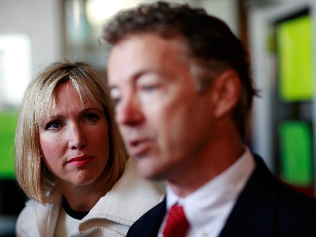 Rand Paul (R), the Republican candidate for Kentucky's U.S. Senate seat, and his wife, Kelley, talk with reporters after casting their ballots November 2, 2010 in Bowling Green, Kentucky. Paul is running against Democratic candidate Jack Conway. (Photo by Tom Pennington/Getty Images)