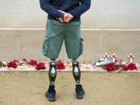 Remembrance Sunday A member of the armed forces with prosthetic legs pays his respects at the Armed Forces Memorial in the National Memorial Arboretum on Armistice Day near Lichfield, Staffordshire, central England, on November 11, 2014. In services around the country tributes were paid to the millions of British servicemen and women …