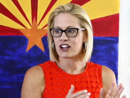 Rep. Kyrsten Sinema, D-Ariz., talks to campaign volunteers at a Democratic campaign office on primary election day Tuesday, Aug. 28, 2018, in Phoenix. Sinema is seeking the current U.S. Senate seat occupied by outgoing Republican Sen. Jeff Flake, and will face the Republican primary winner of the race between Rep. …