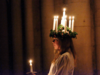 YORK, ENGLAND - DECEMBER 09: Matilda Jarl, 15, from the Jarfalla chamber choir near Stockholm, Sweden plays the role of Lucia as she leads the procession during the Swedish Sankta Lucia Festival of Light service at York Minster on December 9, 2016 in York, United Kingdom. The Sankta Lucia service …