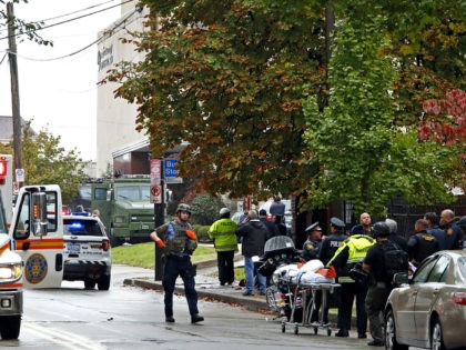 First responders surround the Tree of Life Synagogue where a shooter opened fire Saturday, Oct. 27, 2018. (AP Photo/Gene J. Puskar)
