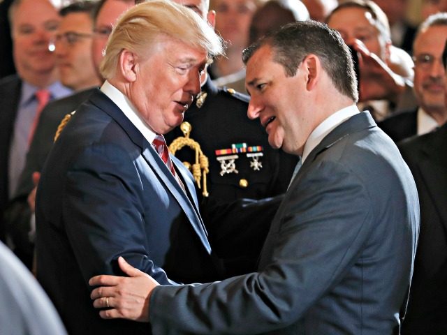 President Donald Trump shakes hands with and talks to Sen. Ted Cruz, R-Texas, in the East