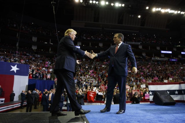 President Donald Trump is greeted by Sen. Ted Cruz, R-Texas, as he arrives for a campaign rally at Houston Toyota Center, Monday, Oct. 22, 2018, in Houston.