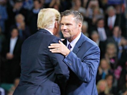 President Donald Trump, left, on stage with Republican gubernatorial candidate Secretary of State Kris Kobach, right, during a campaign rally at Kansas Expocentre, Saturday, Oct. 6, 2018 in Topeka, Kan.