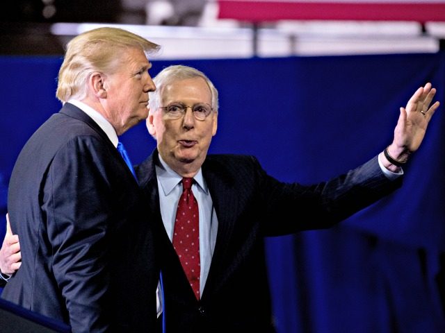 President Donald Trump, left, invites Senate Majority Leader Mitch McConnell, of Ky., right, onstage as he speaks at a rally at Alumni Coliseum in Richmond, Ky., Saturday, Oct. 13, 2018.