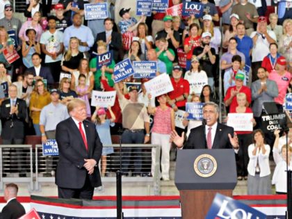 U.S. Congressman Lou Barletta, right, speaks beside President Donald Trump at a rally endo