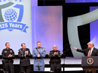 President Donald Trump, far right, recognizes the Target Police officer of the year finalists, from left, Officer Taylor S. Rust of the Plano, Texas, Patrol Officer Mark A. Dallas of the Dixon, Illinois, Washington State Patrol Trooper Nathaniel Dawson and Sergeant Luis Celis of the Doral, Florida during the International …