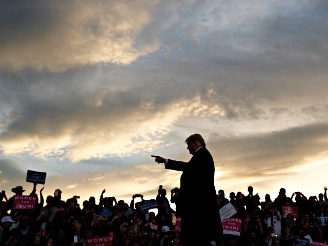 President Donald Trump arrives as the sun sets to speak at a campaign rally at Minuteman Aviation Hangar, Thursday, Oct. 18, 2018, in Missoula, Mont.