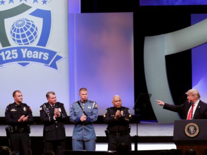 President Donald Trump, far right, recognizes the Target Police officer of the year finalists, from left, Officer Taylor S. Rust of the Plano, Texas, Patrol Officer Mark A. Dallas of the Dixon, Illinois, Washington State Patrol Trooper Nathaniel Dawson and Sergeant Luis Celis of the Doral, Florida during the International …