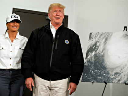 First lady Melania Trump looks on as President Donald Trump reacts to a question about Sen. Elizabeth Warren from a reporter during a briefing with state and local officials on the response to Hurricane Michael, Monday, Oct. 15, 2018, Macon, Ga