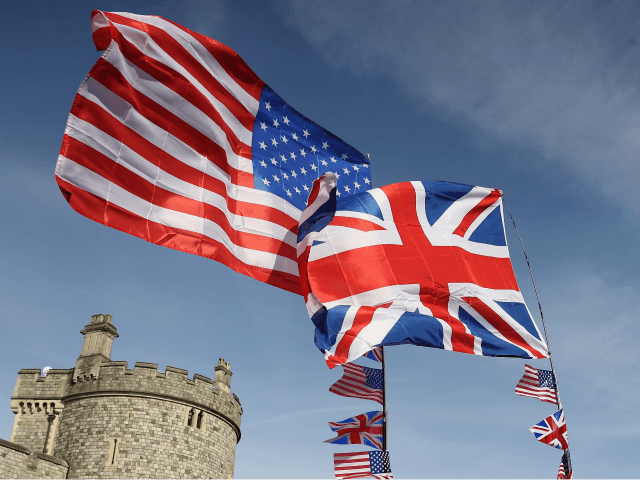 WINDSOR, ENGLAND - MAY 18: The national flags of Great Britain and the United States fly over a merchandise stall ahead of the royal wedding of Prince Harry and Meghan Markle on May 18, 2018 in Windsor, England. (Photo by Chris Jackson/Getty Images)