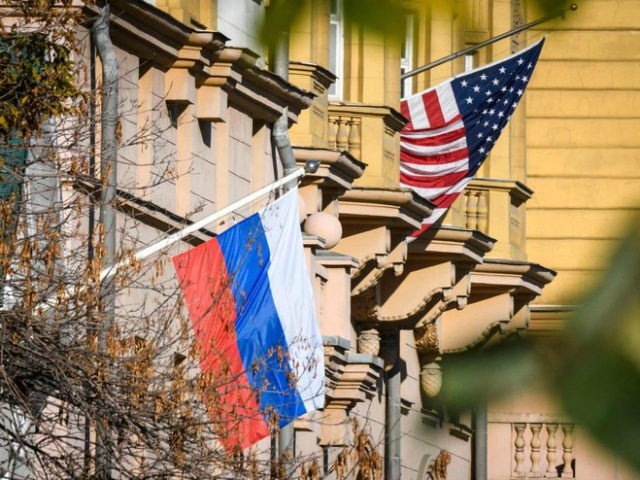 A Russian flag flies next to the US embassy building in Moscow on October 22, 2018. - US n