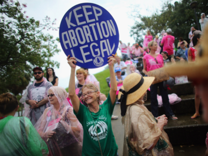 Protesters stand together during a Planned Parenthood rally as the Republican National Convention continues on August 29, 2012 in Tampa, Florida. The Republican party delegates affirmed Mitt Romney as the party's nominee for president August 28. (Photo by Joe Raedle/Getty Images) Editorial subscription SL 3000 x 2000 px | 25.40 …