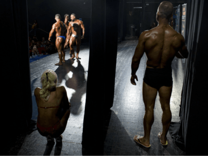 Dozens of glistening competitors took the stage for an annual body building and fitness co