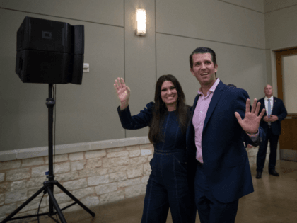 OCTOBER 03: Donald Trump Jr. and Kimberly Guilfoyle make their way toward the stage to speak in support of U.S. Sen. Ted Cruz (R-TX) at a campaign rally on October 3, 2018 in Conroe, Texas. Cruz is in a tight reelection race against Democratic opponent Beto O'Rourke. (Photo by Loren …