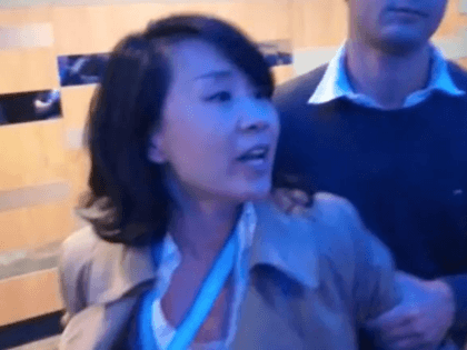 A Chinese Journalist assaults a fringe meeting volunteer at the Conservative Party Conference