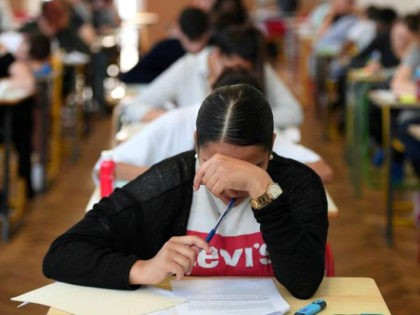 High school students work on a 4 hours philosophy dissertation, that kicks off the French general baccalaureat exam for getting into university, on June 18, 2018 at the lycee Pasteur in Strasbourg, eastern France. (Photo by FREDERICK FLORIN / AFP) (Photo credit should read FREDERICK FLORIN/AFP/Getty Images)