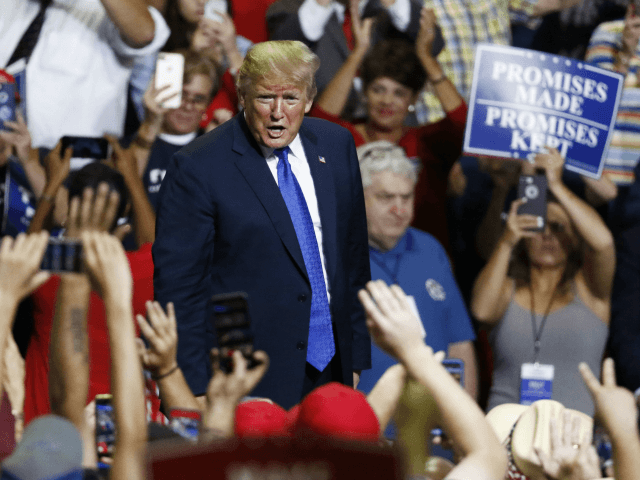 President Donald Trump reacts to supporters as he leaves a rally Tuesday, Oct. 2, 2018, in