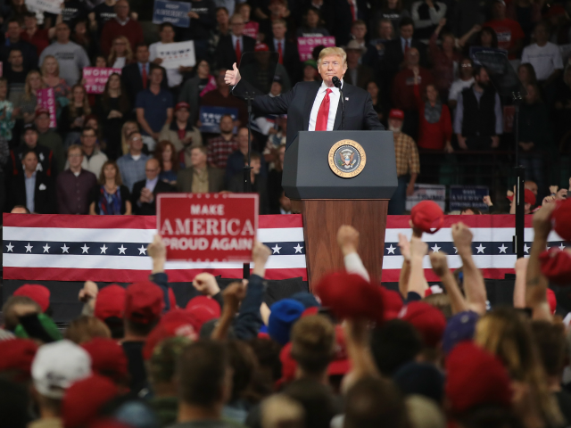 TOPEKA, KS - OCTOBER 06: U.S. President Donald Trump speaks to supporters during a rally at the Kansas Expocenter on October 6, 2018 in Topeka, Kansas. Trump scored a political victory today when Judge Brett Kavanaugh was confirmed by the Senate to become the next Supreme Court justice. (Photo by …