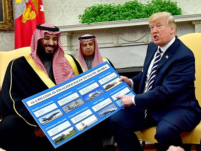 WASHINGTON, DC - MARCH 20: President Donald Trump (R) holds up a chart of military hardware sales as he meets with Crown Prince Mohammed bin Salman of the Kingdom of Saudi Arabia in the Oval Office at the White House on March 20, 2018 in Washington, D.C. (Photo by Kevin …