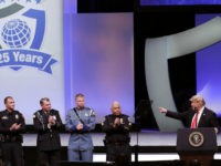 President Donald Trump, far right, recognizes the Target Police officer of the year finalists, from left, Officer Taylor S. Rust of the Plano, Texas, Patrol Officer Mark A. Dallas of the Dixon, Illinois, Washington State Patrol Trooper Nathaniel Dawson and Sergeant Luis Celis of the Doral, Florida during the International …