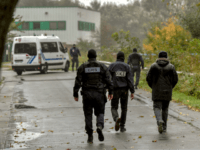 french police raid Policemen spread around the 'Centre Zahra France' religious association in Grande Synthe near Dunkirk early on October 2, 2018 during an operation of 'terrorism prevention'. - 3 people have been detained in police custody during the operation involving 200 policemen. (Photo by Philippe HUGUEN / AFP) (Photo credit should read …
