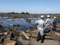 fukushima MINAMISOMA, JAPAN - MARCH 12: (JAPANESE NEWSPAPERS OUT) Rescue workers look over an area flooded by the tsunami on March 12, 2011 in Minamisoma, Fukushima, Japan. An earthquake measuring 8.9 on the Richter scale hit the northeast coast of Japan yesterday causing tsunami alerts throughout countries bordering the Pacific Ocean …