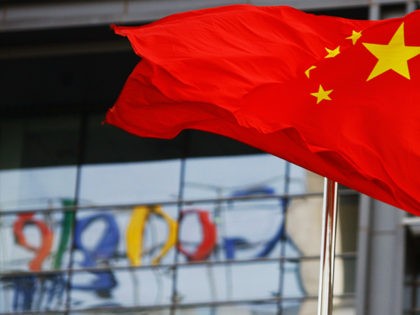 The Google logo is reflected in windows of the company's China head office as the Chinese