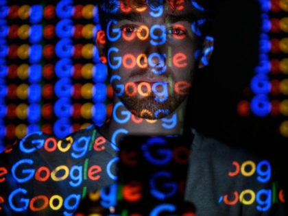 LONDON, ENGLAND - AUGUST 09: In this photo illustration, The Google logo is projected onto