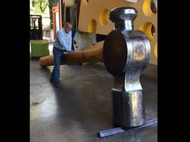 A California community is trying to recover a massive 800-pound hammer sculpture after it