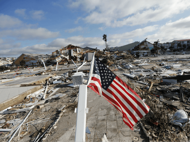 An American flag flies amidst destruction in the aftermath of Hurricane Michael in Mexico Beach, Fla., Thursday, Oct. 11, 2018. (AP Photo/Gerald Herbert)